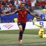 Logotipo Espanha nas meias-finais do Mundial2026 ao vencer Bélgica como novo golo de Merino